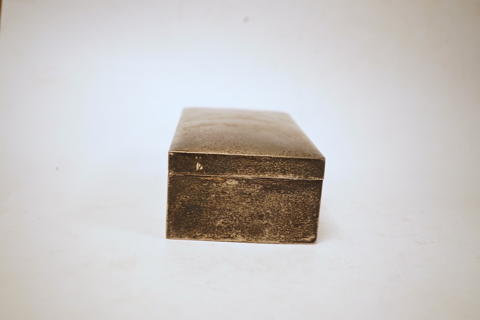 A George V rectangular plain silver cigarette box, Walker & Hall, Sheffield, 1929, 17.9cm.